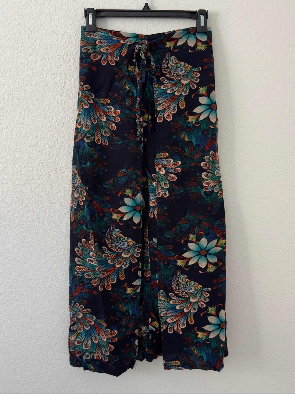 Multi-colored floral and peacock feather print wrap around pants with tie waist